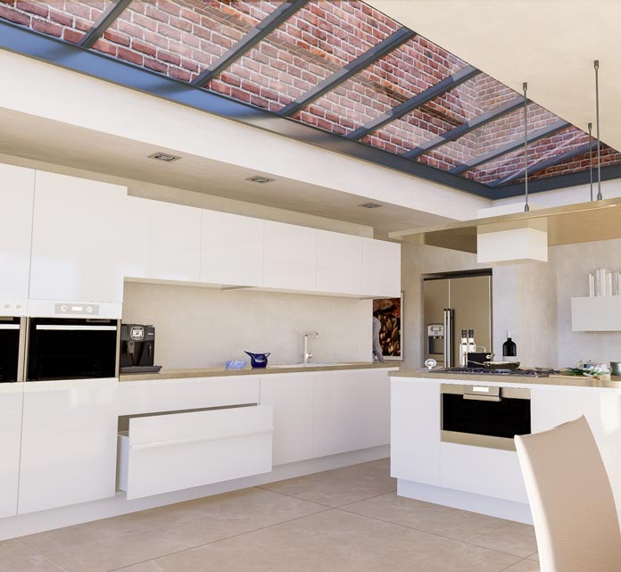 A bright, contemporary kitchen with glossy white handleless cabinetry and drawers along the back wall and a central island. A long strip skylight with a metal frame runs above, flooding the space with natural light.